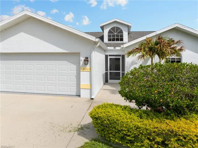 View of front of house featuring a garage, stucco siding, driveway, and roof with shingles