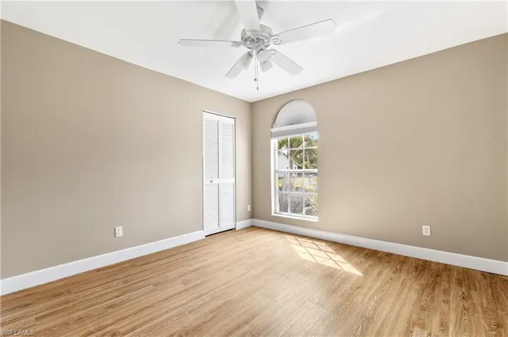 Spare room featuring light wood-type flooring and ceiling fan