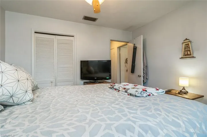 Bedroom with a closet and ceiling fan