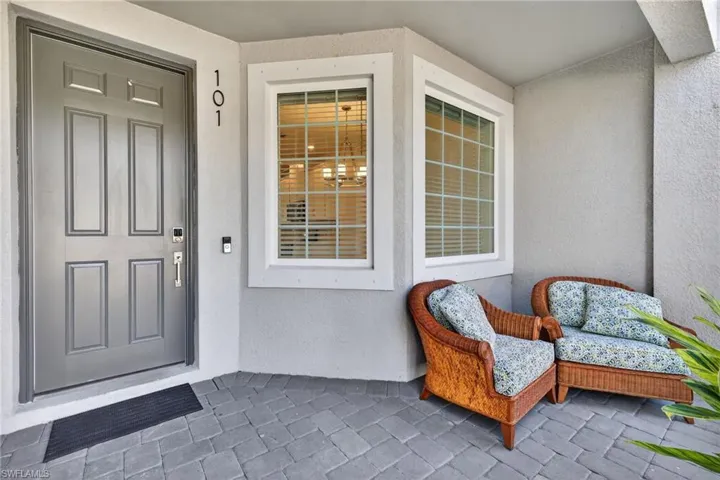 Doorway to property with stucco siding