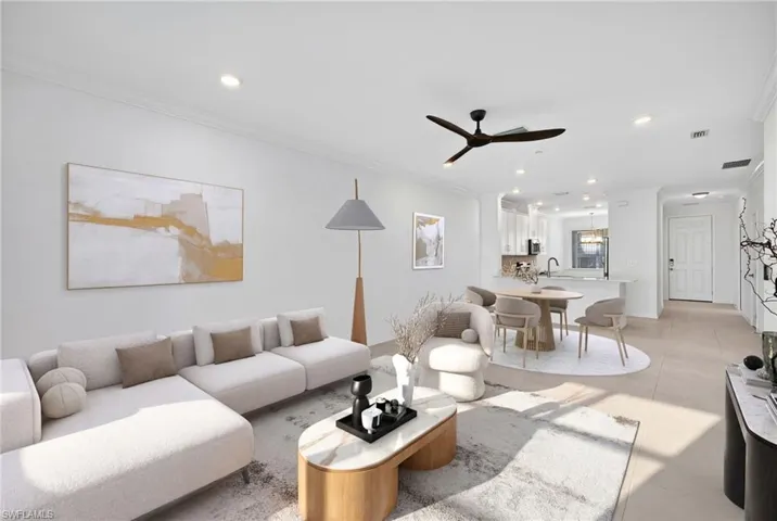 Living room featuring a ceiling fan, crown molding, and recessed lighting