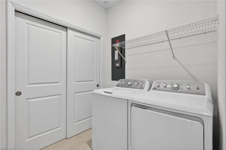 Laundry room featuring washing machine and clothes dryer