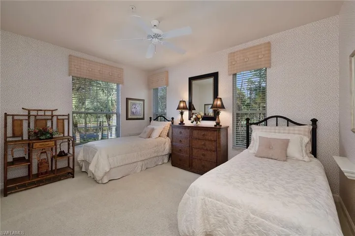 Bedroom with light carpet and ceiling fan