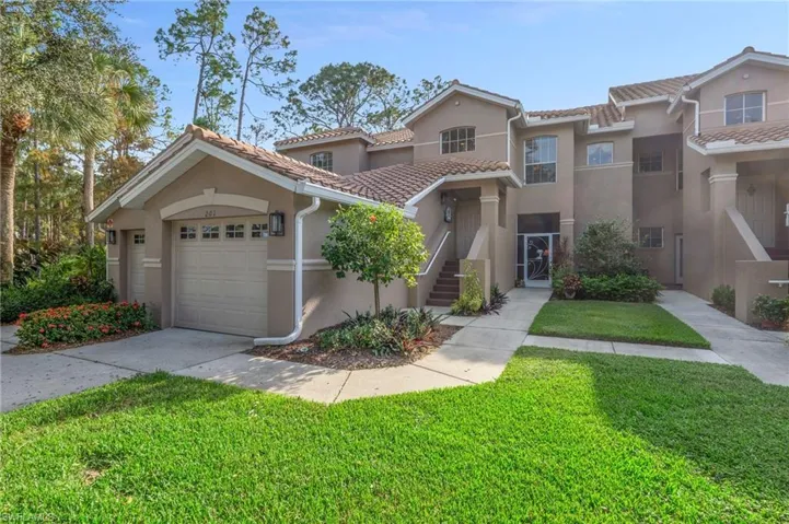 Front entrance with garage and driveway