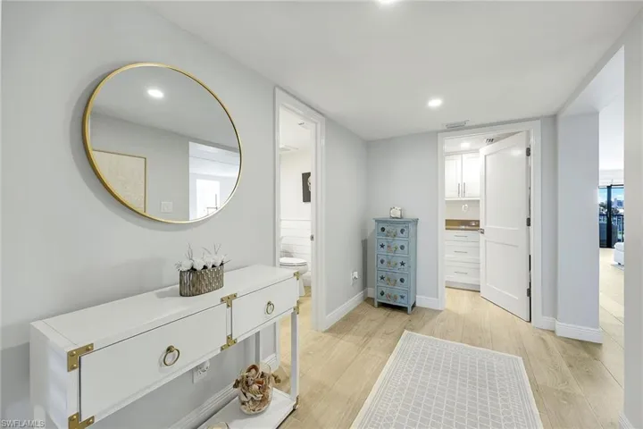 Full bath featuring light wood-type flooring and recessed lighting