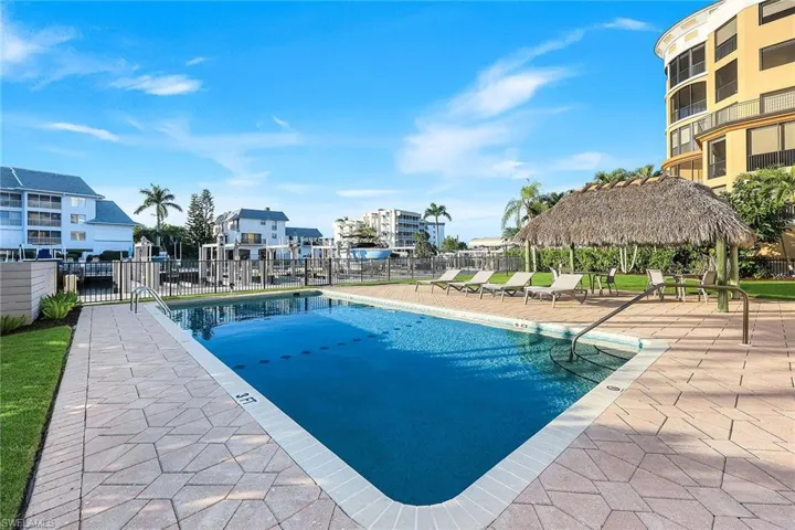 Community pool with a patio area