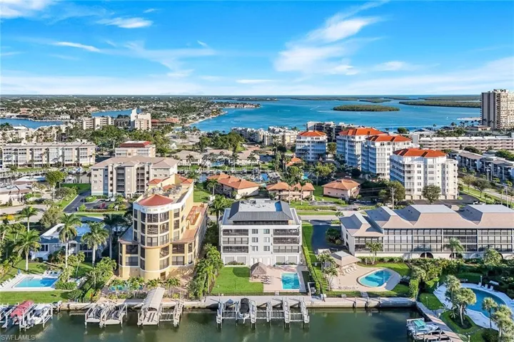 View of urban area featuring a large body of water and a pool