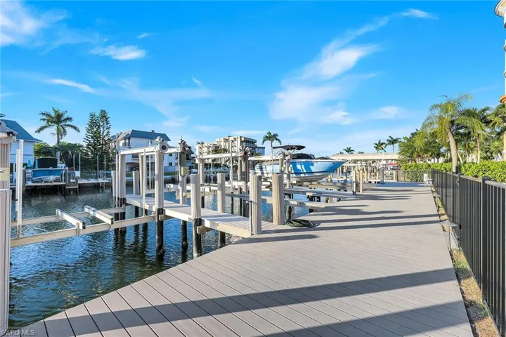 Dock with boat lift and a water view
