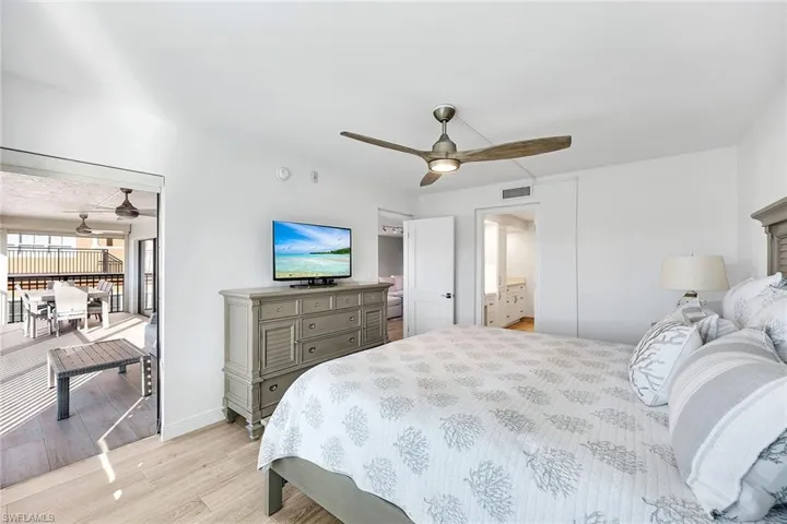 Bedroom with light wood finished floors and ceiling fan