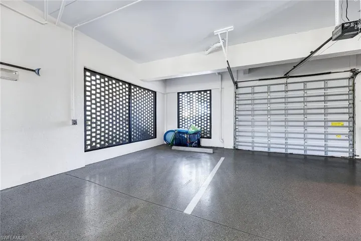 Garage featuring a garage door opener