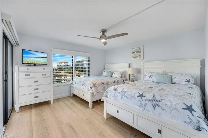 Bedroom featuring light wood-style flooring and ceiling fan