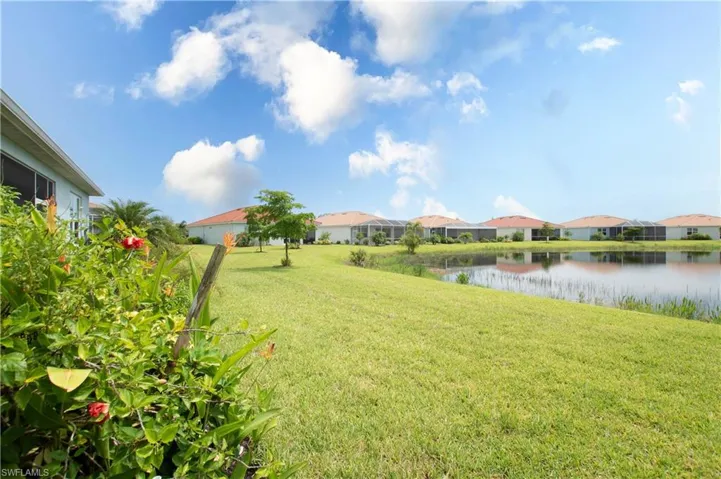 View of yard with a water view