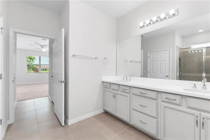 Master bathroom featuring dual vanity and tile flooring