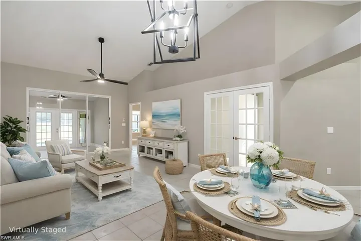 Virtually Staged Great Room with access to a Bedroom (French Doors), the Master Bedroom, a Sunroom and the Lanai