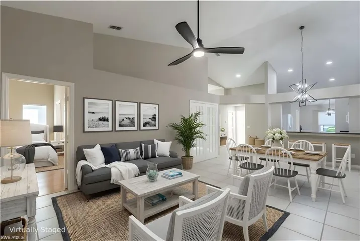 Virtually Staged Great Room with Living and Dining Area and Kitchen in the back