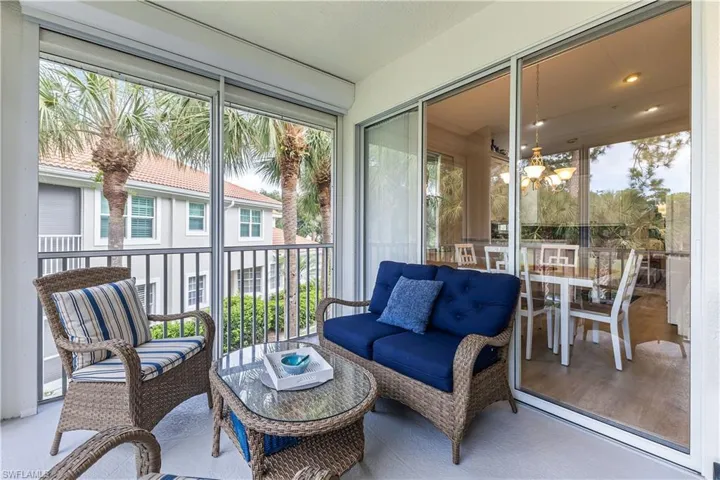 Lanai with a wealth of natural light and a chandelier