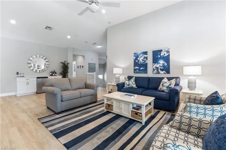 Living room featuring light wood-type flooring and ceiling fan