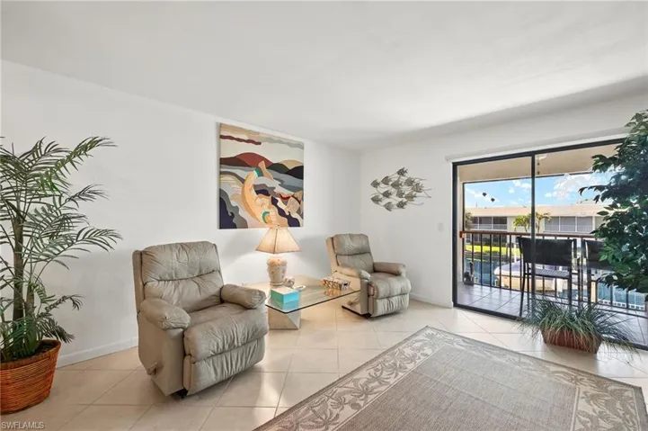 Living area with light tile patterned flooring
