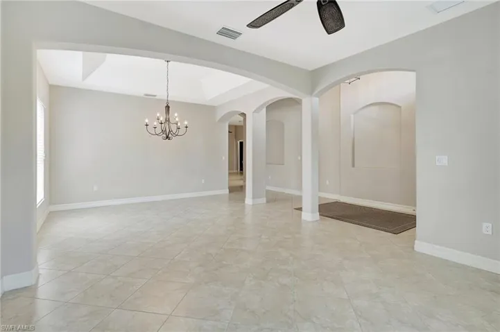 Living/Dining Room/Large Foyer with arched architecture