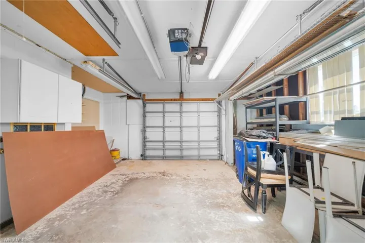 Garage featuring a garage door opener