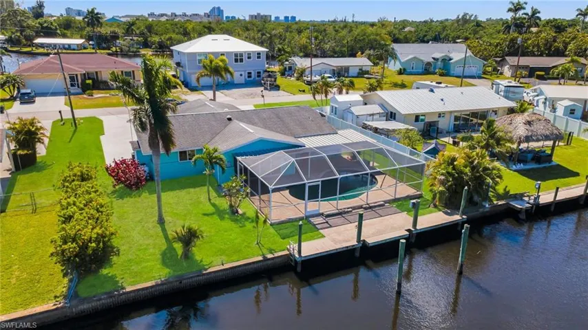 Aerial view featuring a residential view and a water view