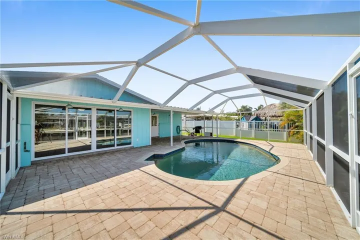 Pool featuring fence, a lanai, and a patio area