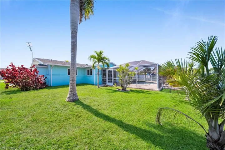 View of yard with a lanai