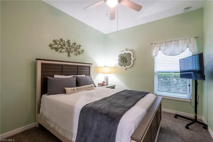 Bedroom featuring carpet floors and ceiling fan