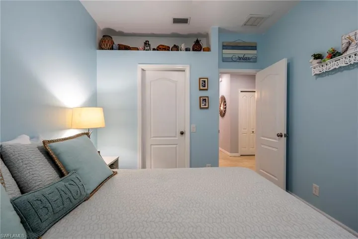 Bedroom featuring a closet and light carpet