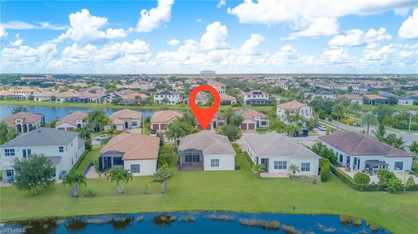 Aerial view of residential area with a nearby body of water
