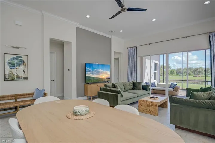 Dining room featuring crown molding, recessed lighting, and a ceiling fan