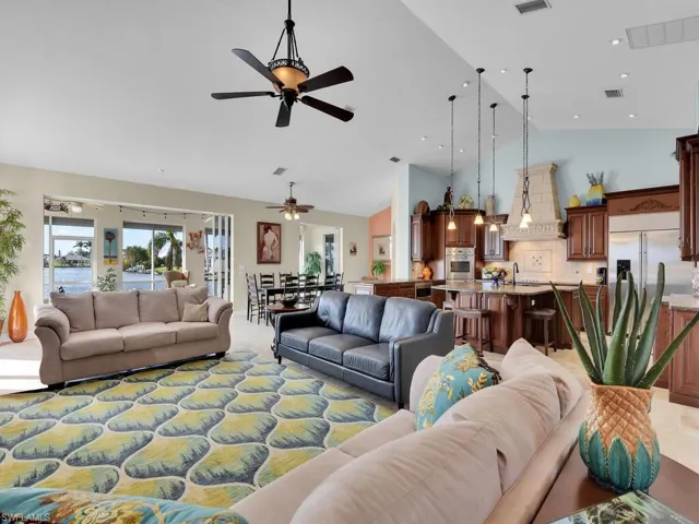 Living room featuring high vaulted ceiling
