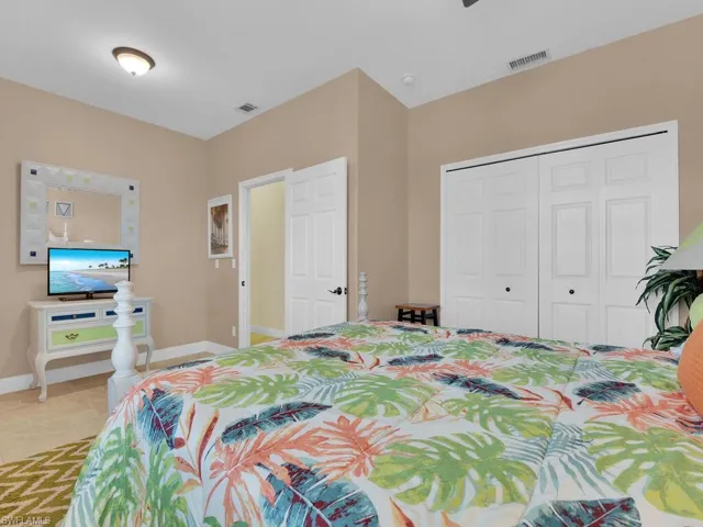 Bedroom featuring a closet and light tile patterned floors