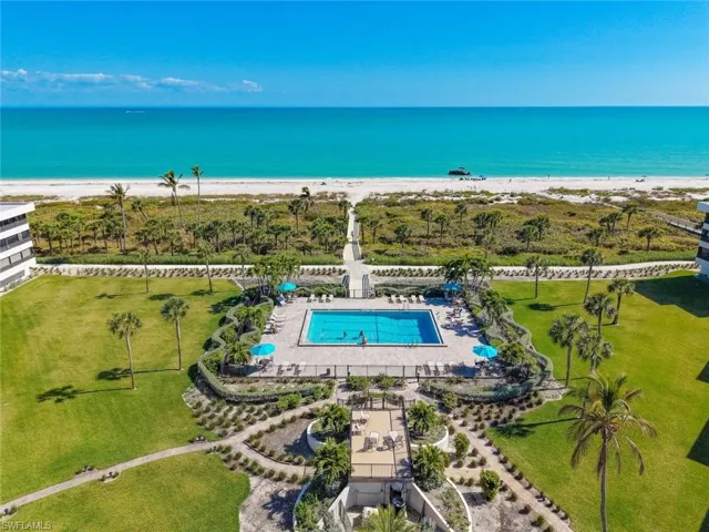 Aerial view of a pool area and extended coastline