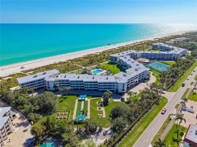 Aerial view of expansive coastline and apartment complex