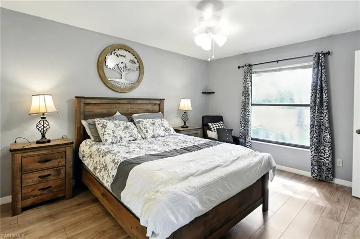 Bedroom featuring baseboards and light wood-style flooring