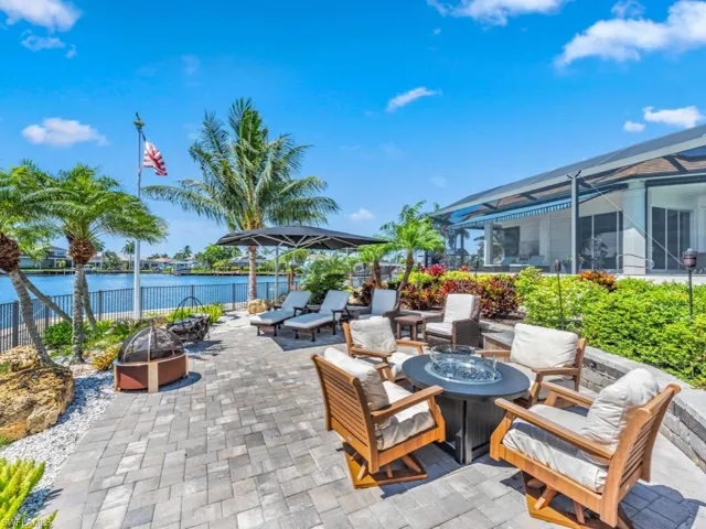 View of patio featuring a water view and an outdoor fire pit