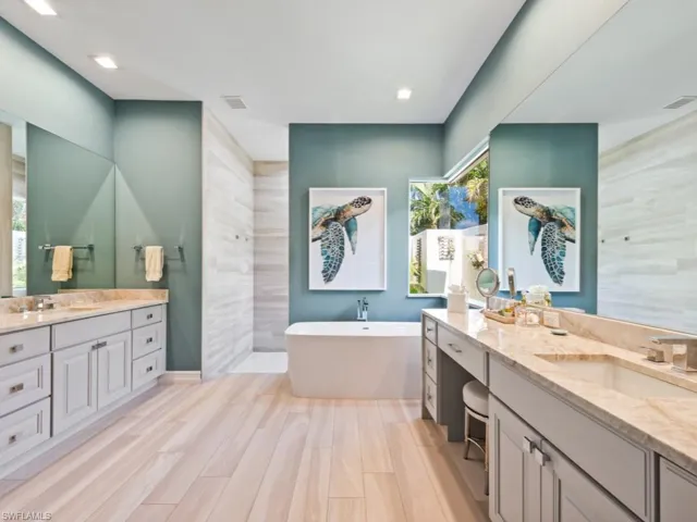 Bathroom with vanity and a bathtub