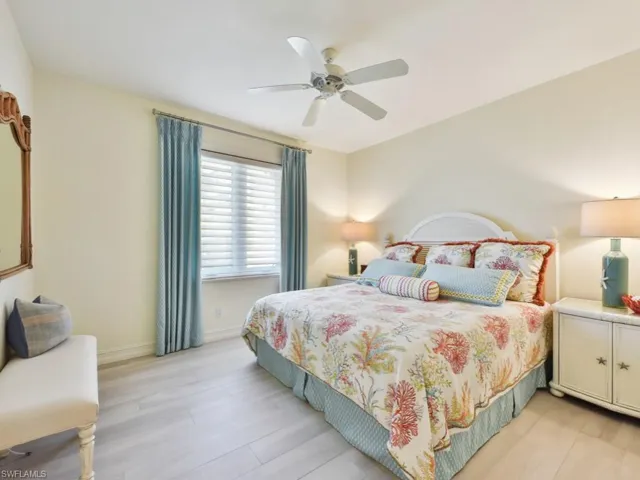 Bedroom featuring ceiling fan and light hardwood / wood-style floors