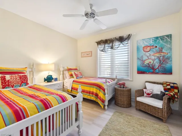 Bedroom with light hardwood / wood-style flooring and ceiling fan