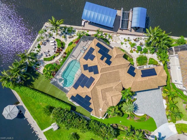 Birds eye view of property featuring a water view