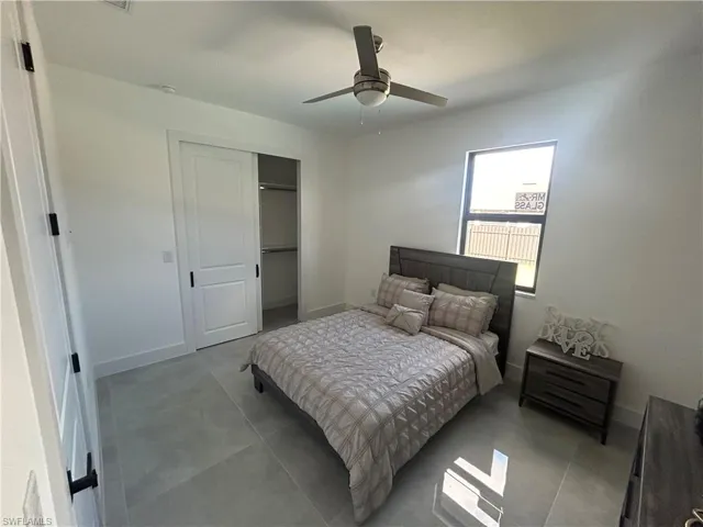 Bedroom featuring a closet and ceiling fan