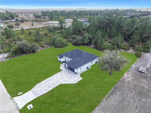 Aerial view of property and surrounding area