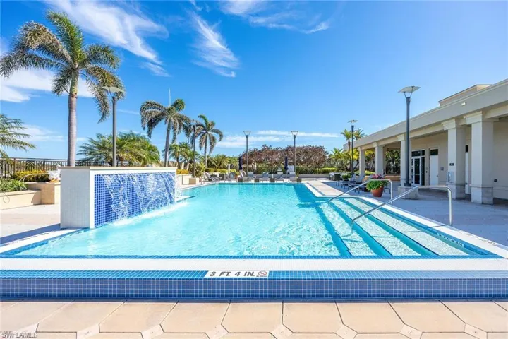 View of pool featuring a patio and pool water feature