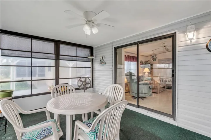 Sunroom / solarium featuring ceiling fan