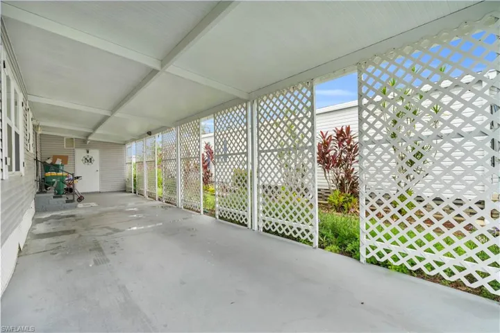 View of patio / terrace featuring a carport