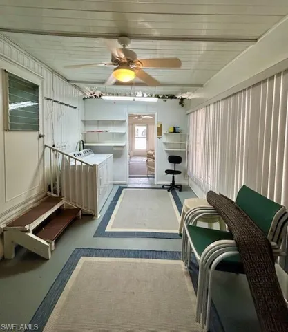 Sunroom / solarium featuring washer / clothes dryer
