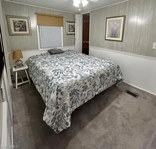 Bedroom with carpet and a ceiling fan
