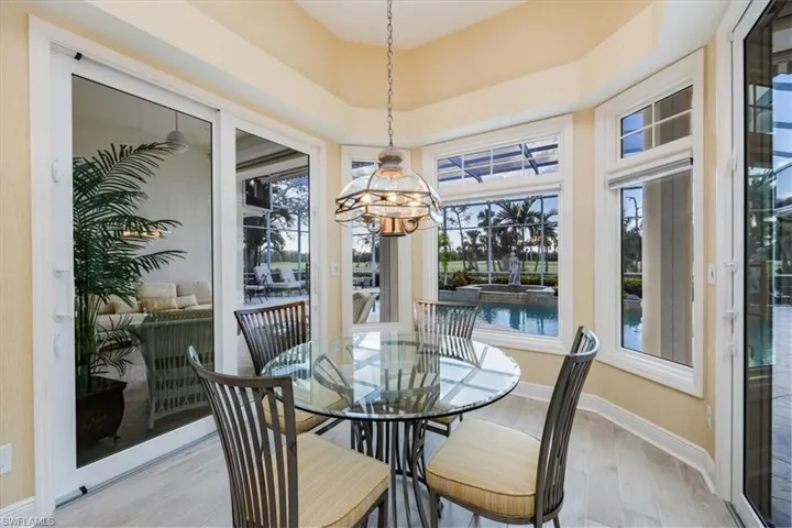 Dining area with a chandelier and light wood-type flooring