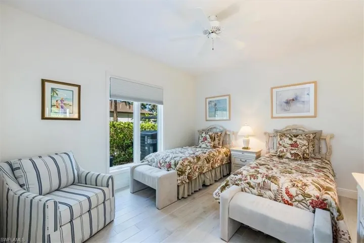 Bedroom featuring light hardwood / wood-style flooring and ceiling fan
